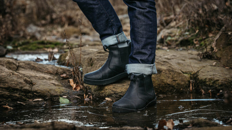Model stepping into water in Kodiak Boots
