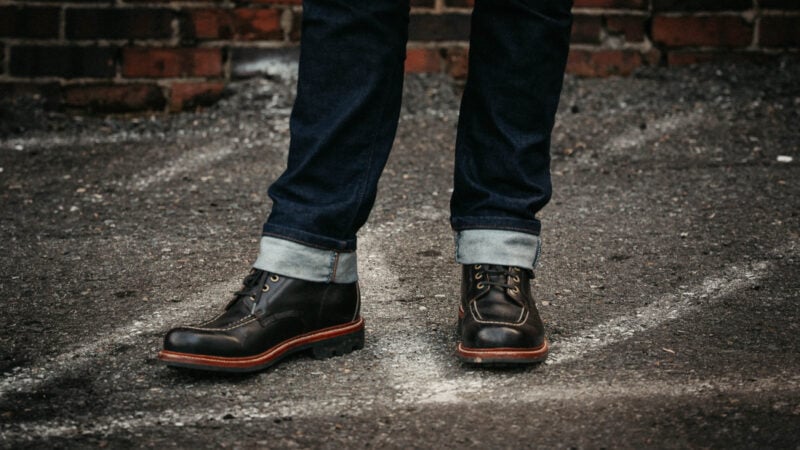 Model wearing Grant Stone Brass Boots shining