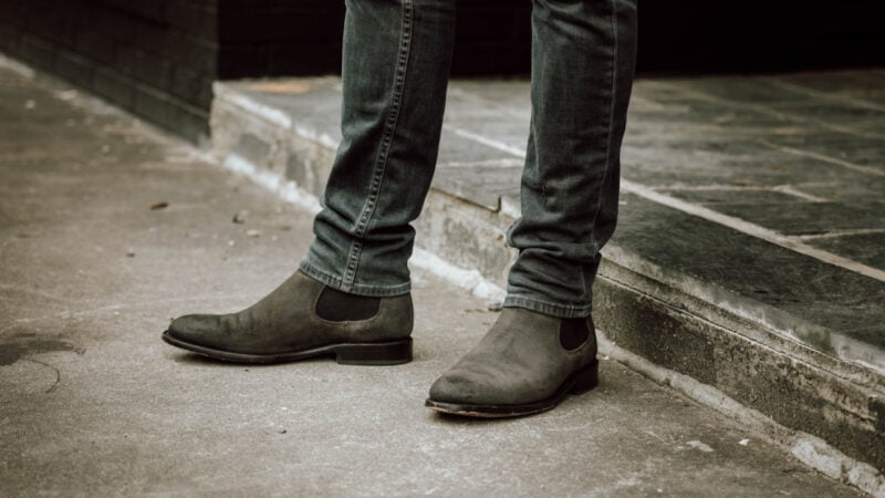 Model wearing Thursday Boots Cavalier covered by jeans