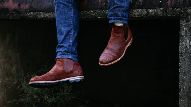 Model keeping his Grant Stone Chelsea Boots up outside
