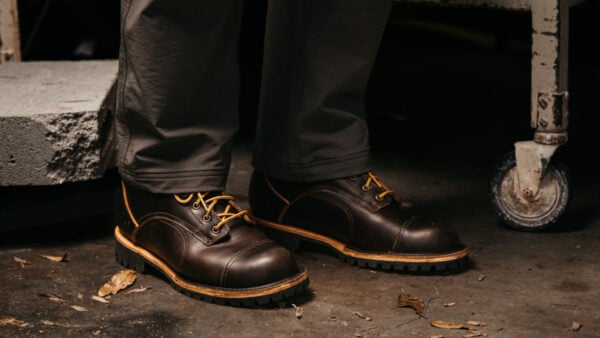 William Barton from BootSpy wearing Origin boots in the workshop profile view